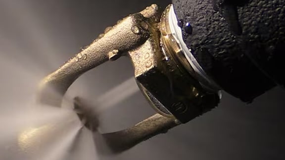 Close-up of a fire sprinkler in action
